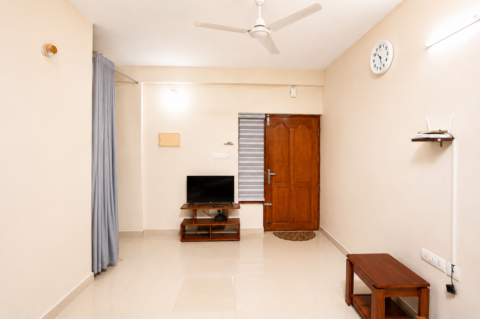 Living area with TV at Hima Havens Guruvayur Homestay